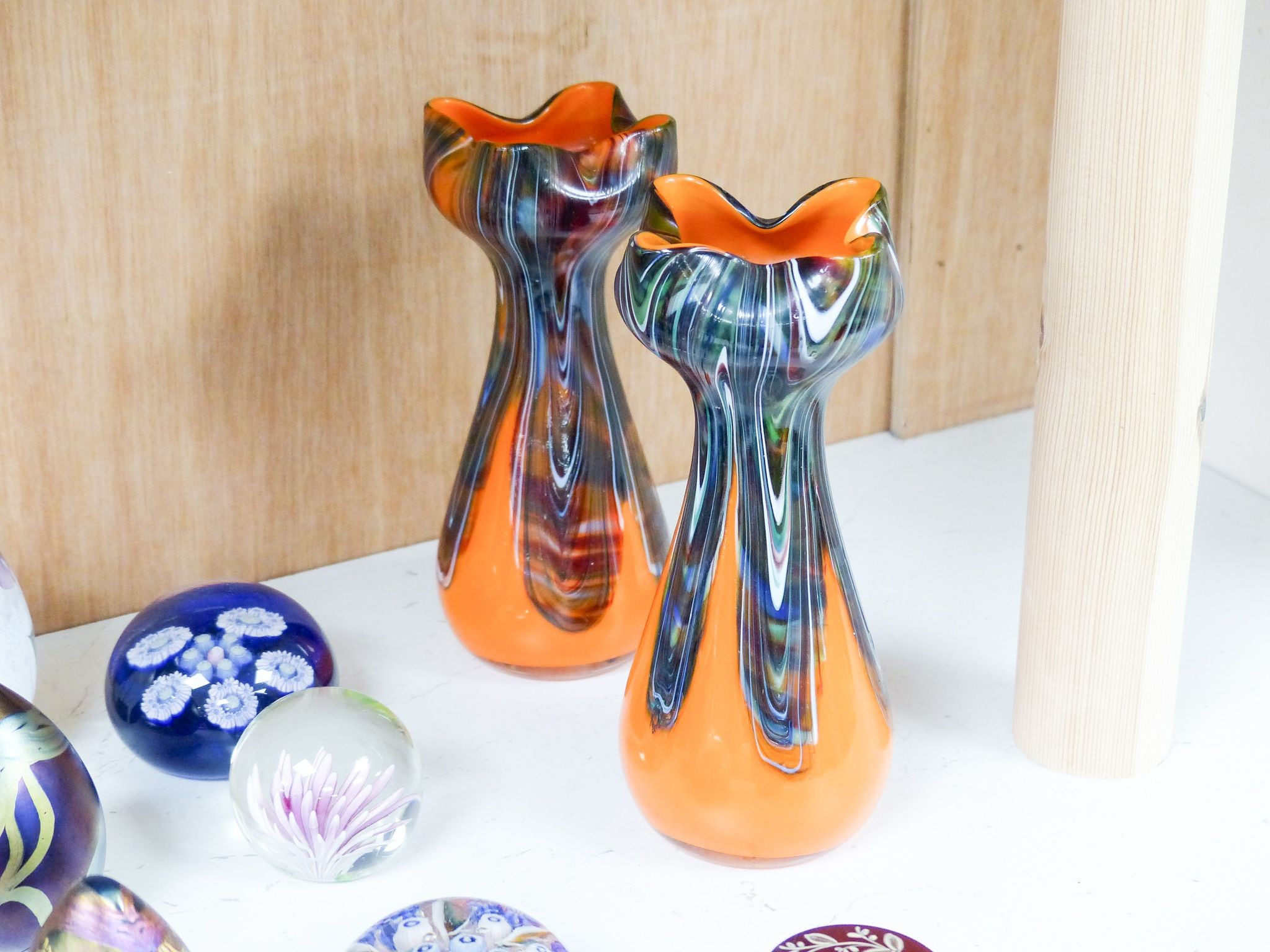 A group of 20th century glass paperweights and studio glass vases, Tallest 24 cm high